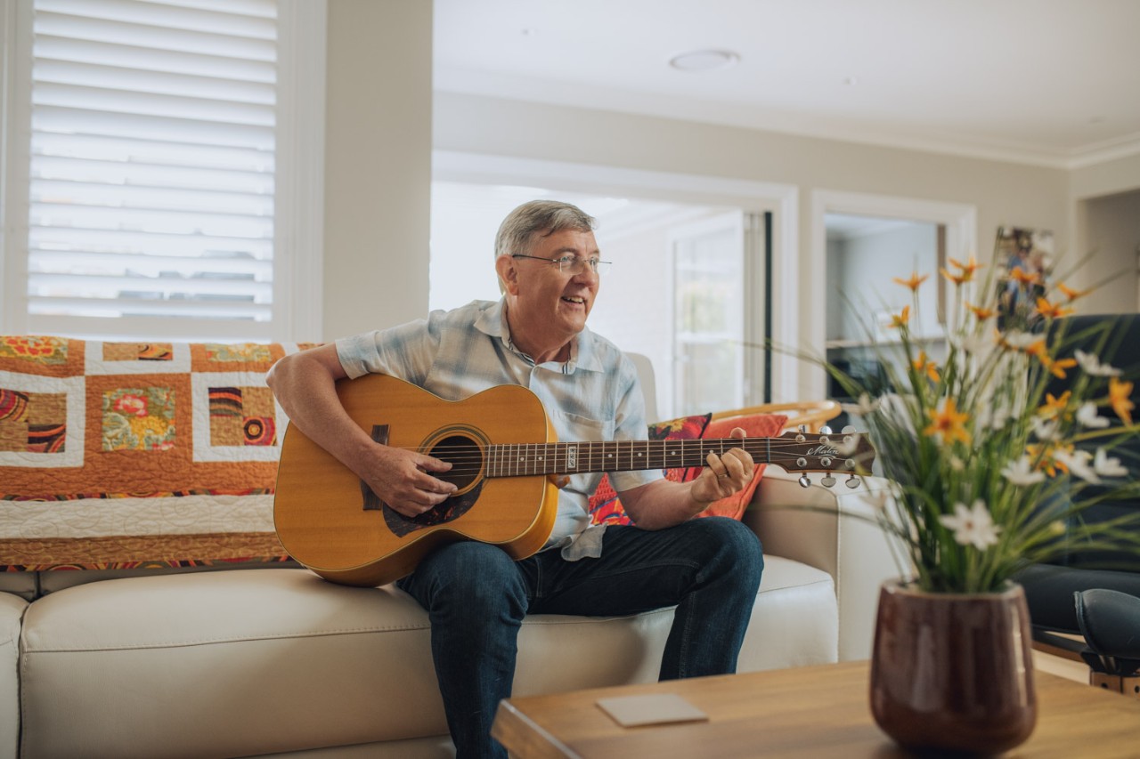 Scott playing the guitar